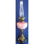 Brass double burner oil lamp (lacks burner) with pink glass reservoir,