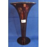 Ruby glass flared trumpet vase on circular base.