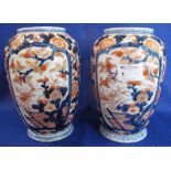 Pair of Japanese Imari porcelain baluster shaped vases.