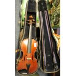 Early 20th Century Stradivarius copy violin in case together with two bows.