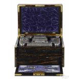 Extensive English rosewood cased dresser set, retailed by Tiffany & Co., the silver mounts, 1865-