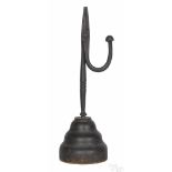 Wrought iron rush light, 19th c., mounted to a turned pine base, 11 1/4'' h. Provenance: Estate of