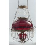 Victorian brass chandelier with a dark ruby shade and hanging prisms, 15'' dia.