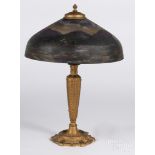 Gilt metal table lamp, early 20th c., with a reverse painted shade, 23'' h.