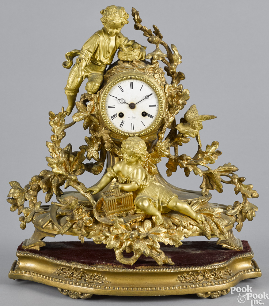 French gilt bronze figural mantel clock, late 19th c., the dial signed Hry Marc Paris, together with