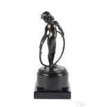 Patinated bronze girl with a hoop, 20th c., monogrammed on base, 7 1/4'' h. Provenance: Private