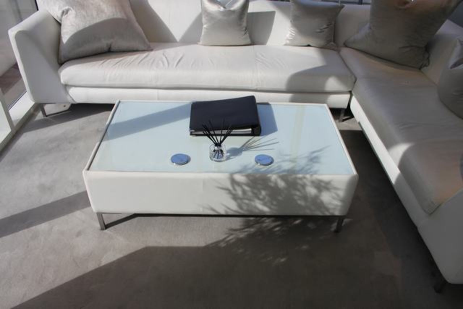 White bonded leather glass top coffee table chrome legs 1300mm x 720mm x 400mm