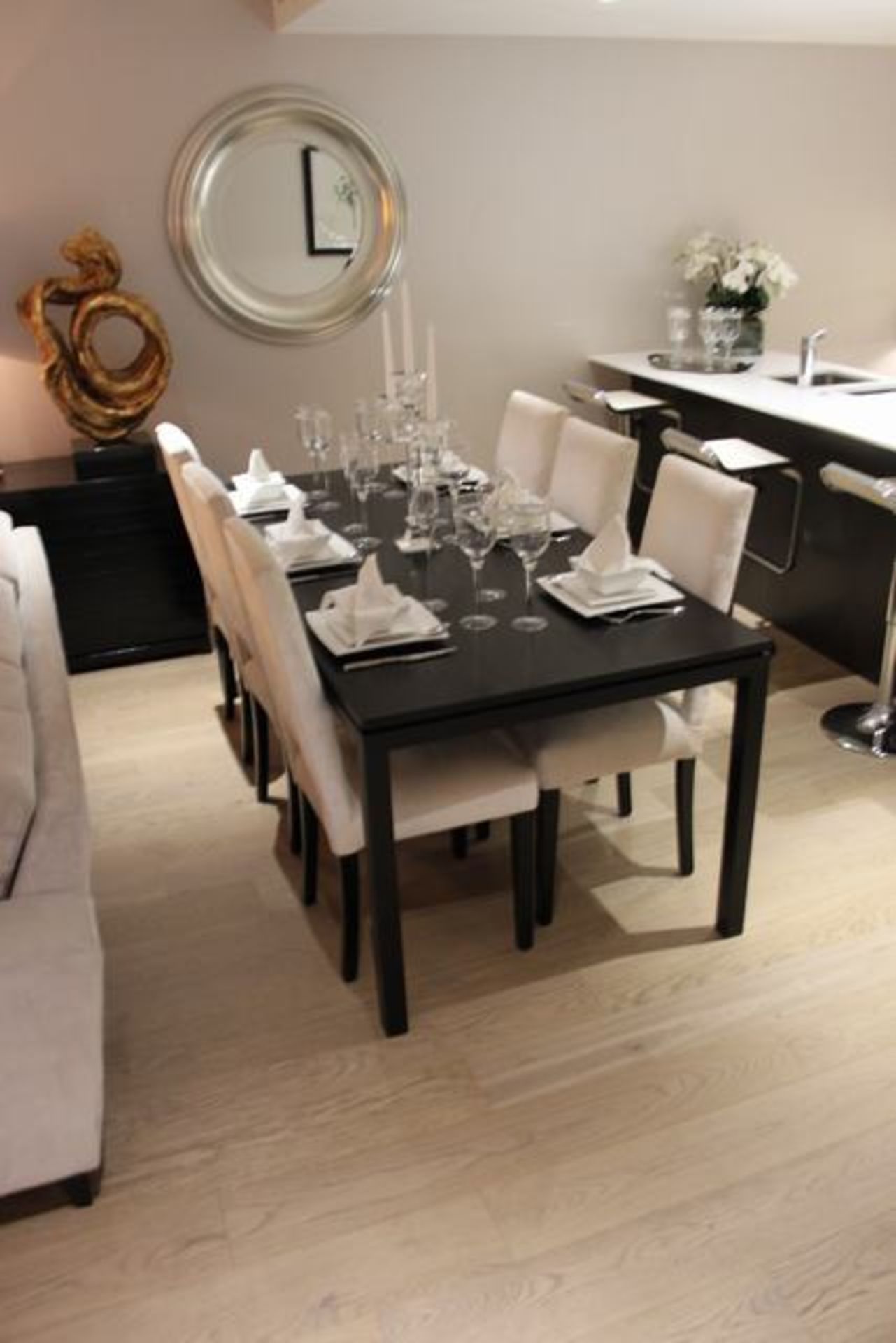 A black ash dining table 1900mm x 900mm x 770mm complete with six upholstered high back dining