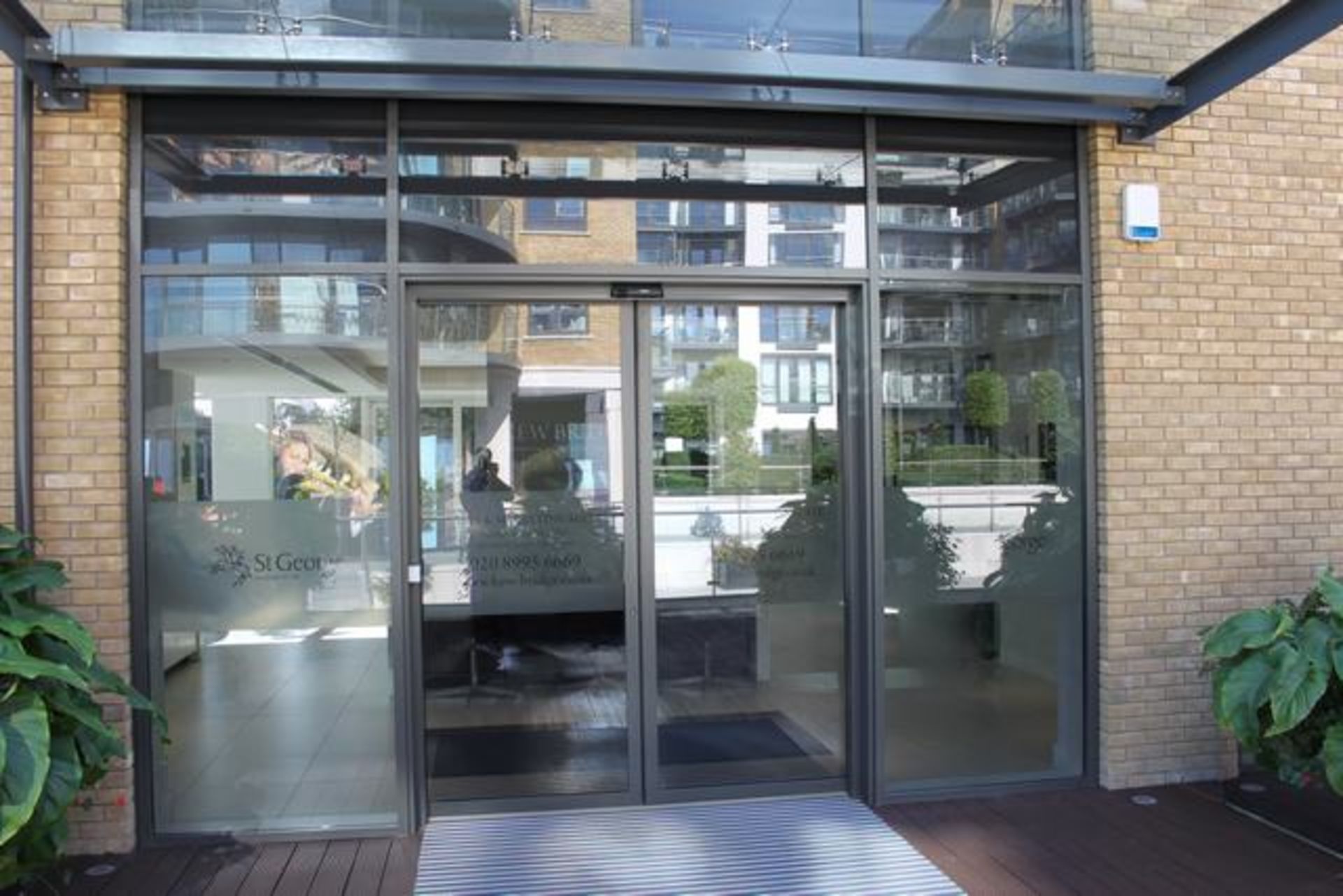 A pair of glass sliding external door s with Geze sliding door system automation comprises of a