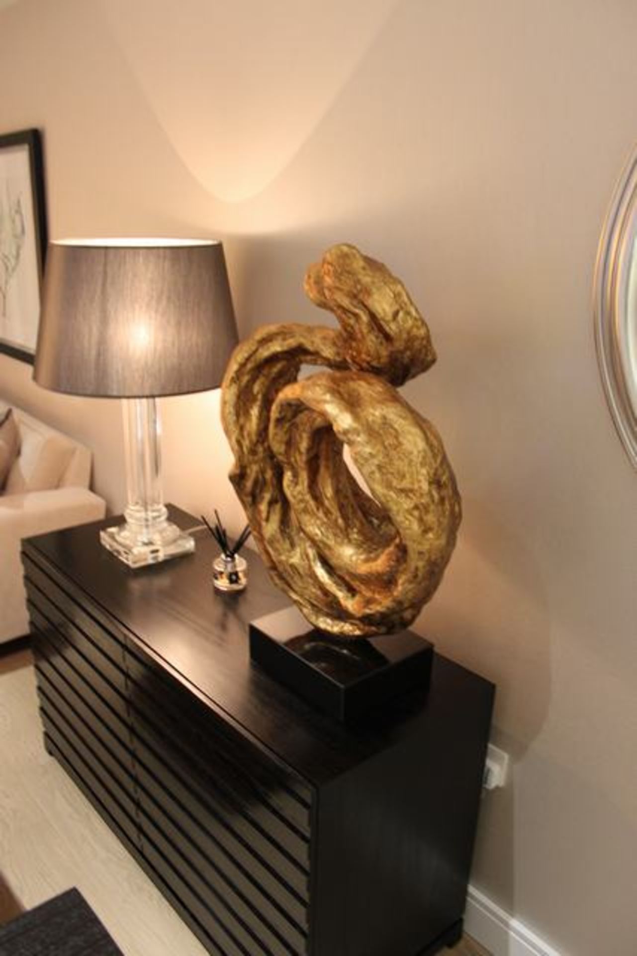 Abstract gold painted sculpture on plinth 860mm x 500mm