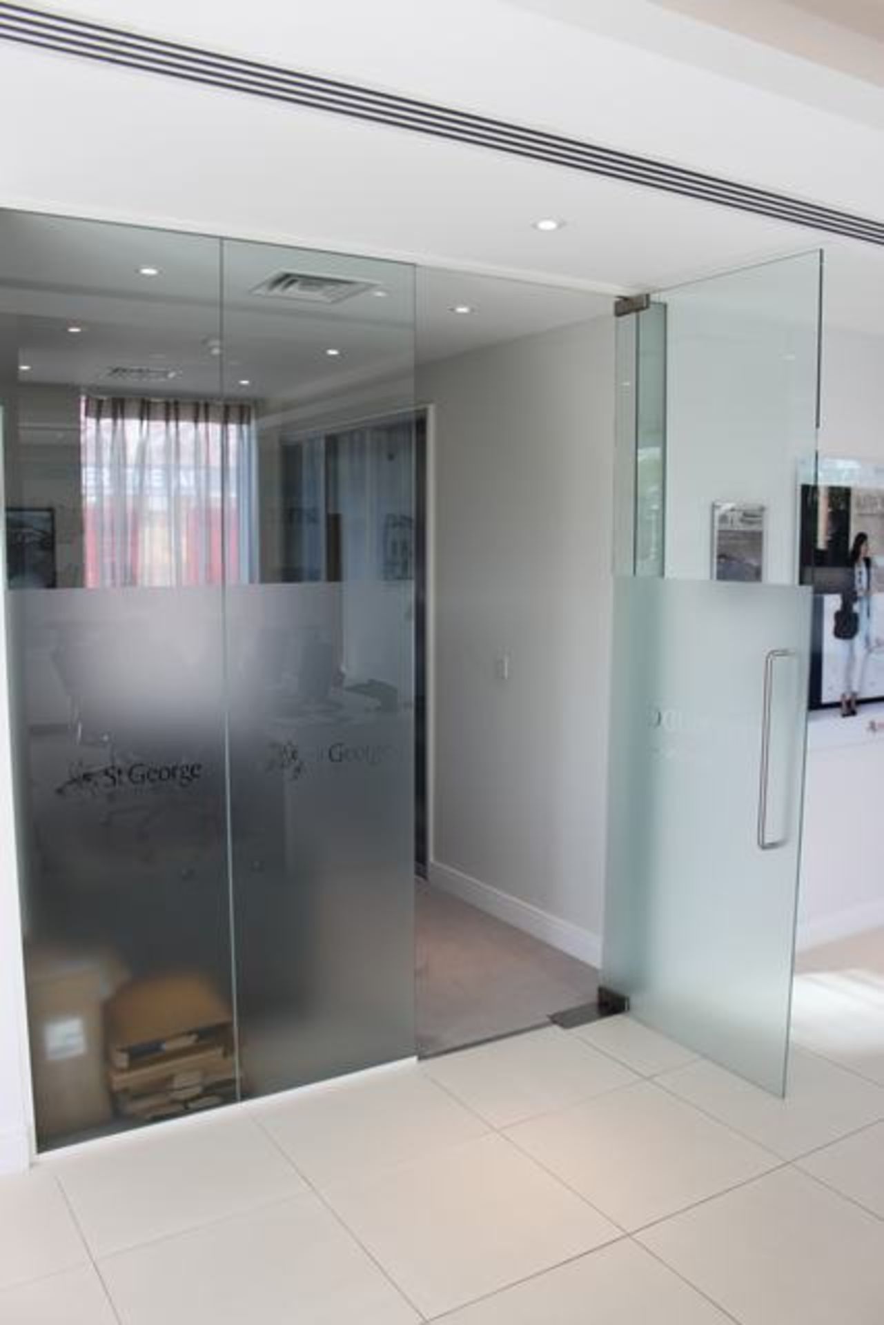 Glass partitioning partly frosted spans 2300mm x 2500 with internal opening glass door being 900mm x