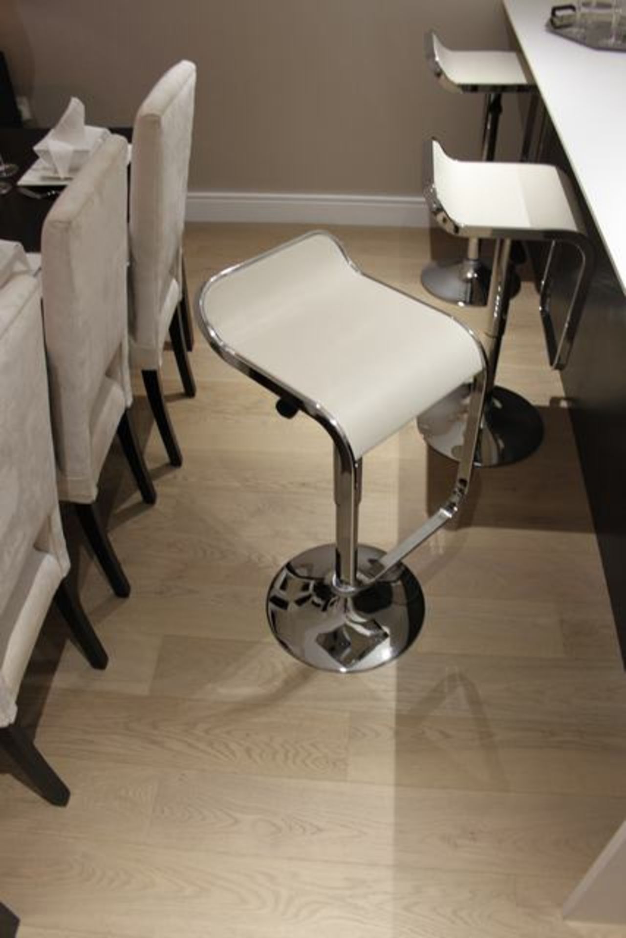 A set of 3 x Dwell Niagara bar stools polished chrome finish padded cream faux leather seat