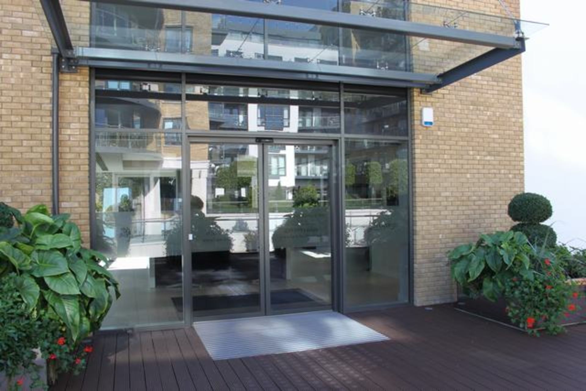 A pair of glass sliding external door s with Geze sliding door system automation comprises of a - Image 2 of 2