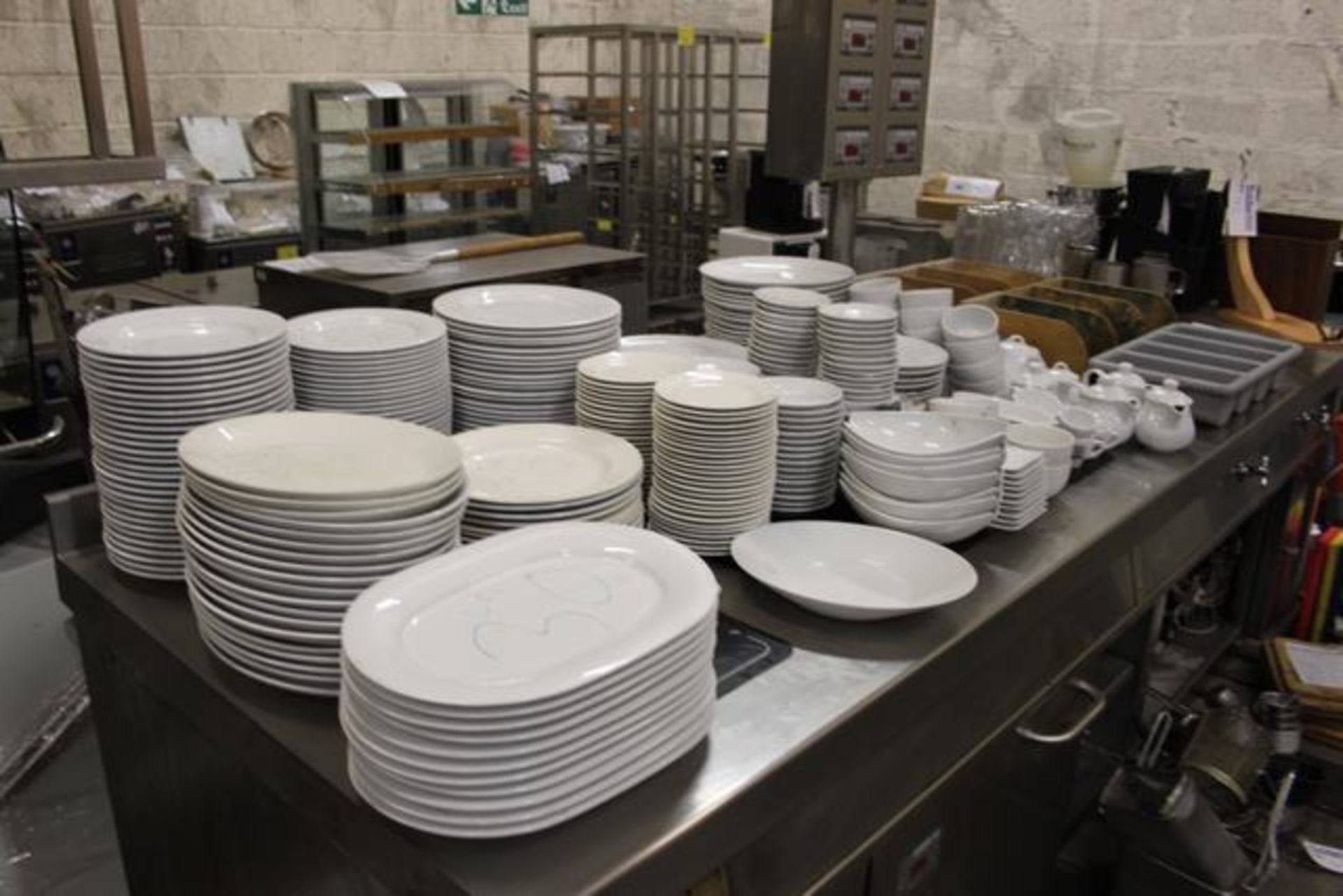 Large quantity of white table ware comprising of dinner plates, bowls, teapots, ramekins, cups and