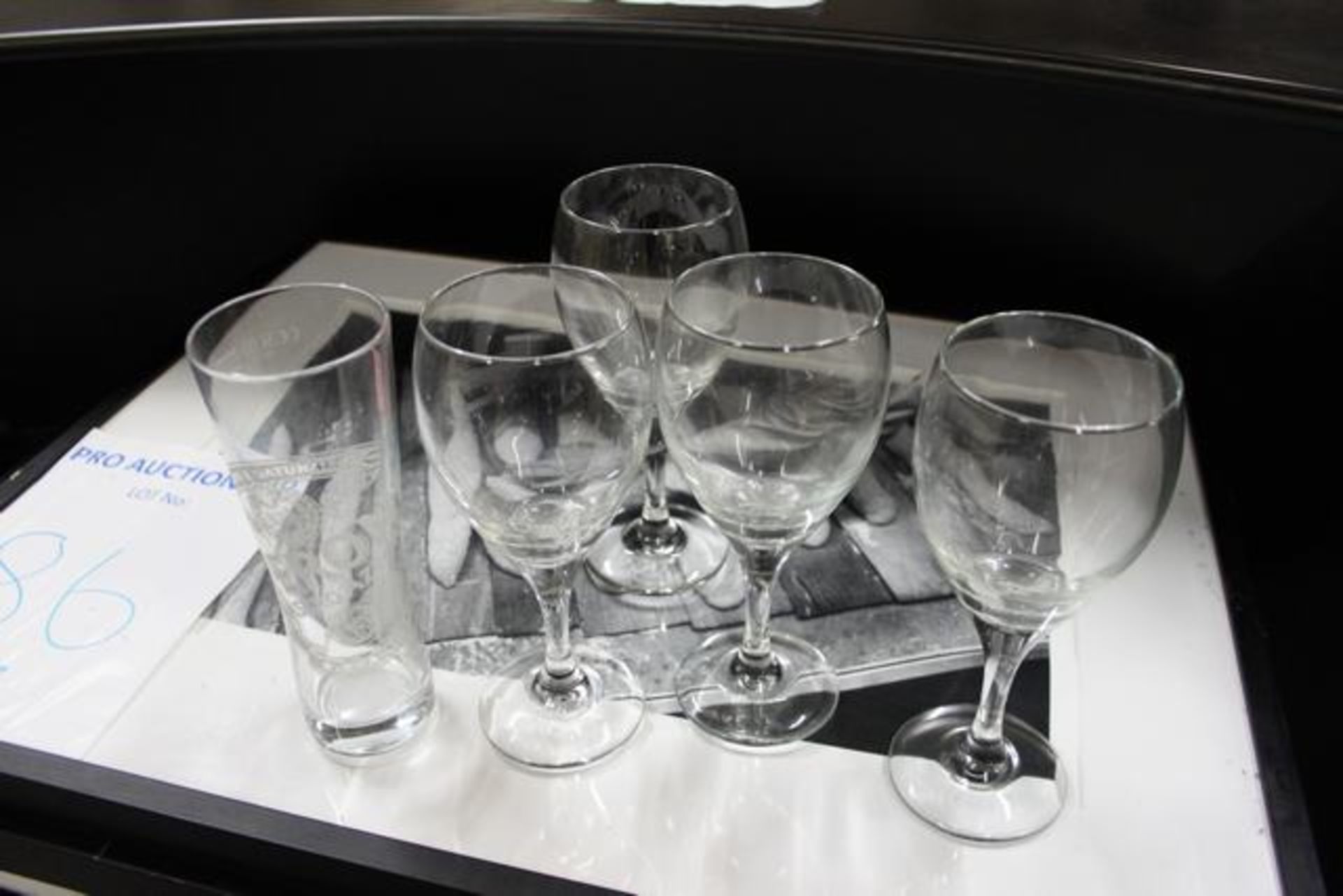 Various glassware to include wine glasses, tumblers and half pint glasses