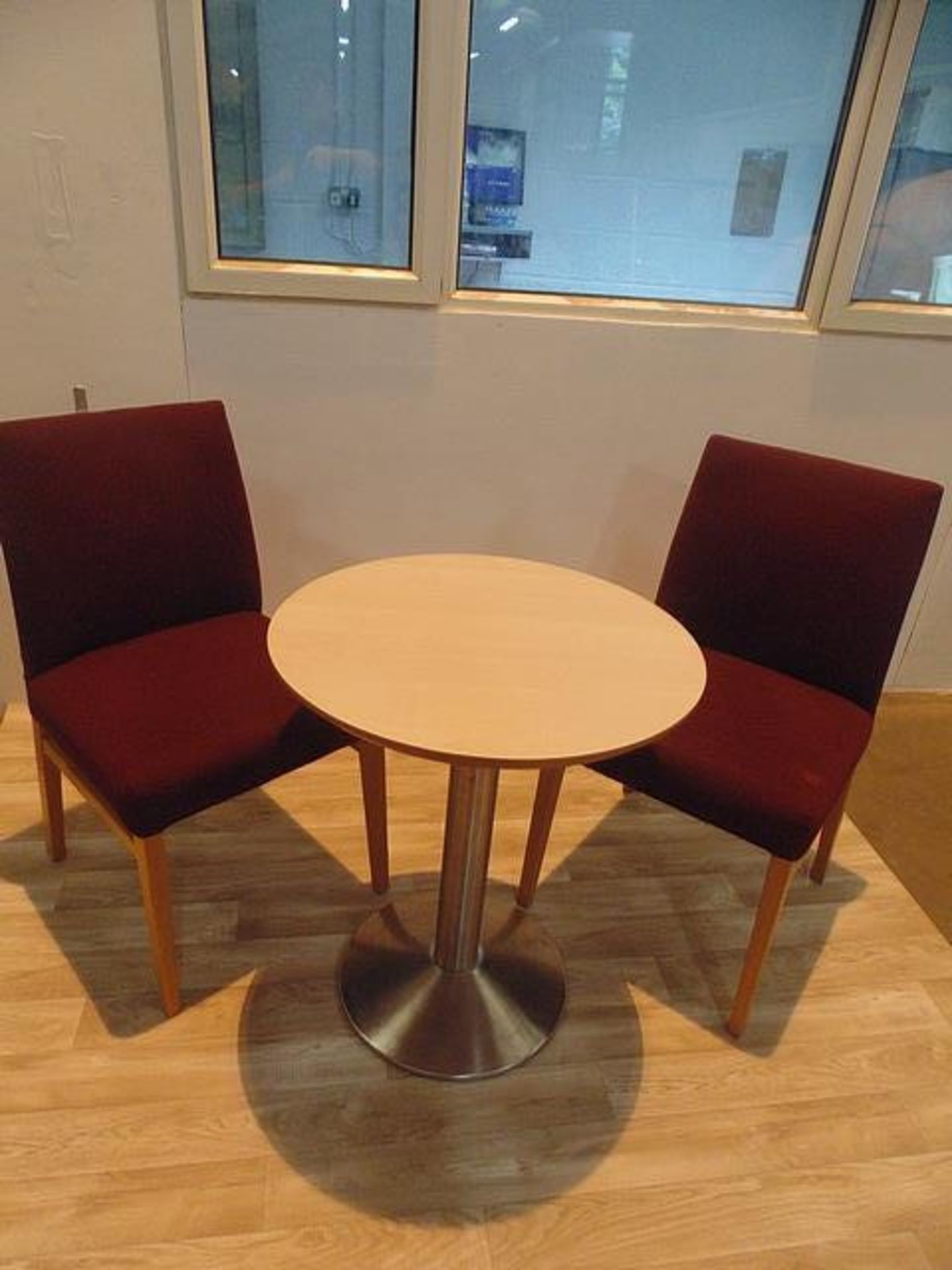 Beach round top table with stainless steel pedestal complete with two upholstered side chairs