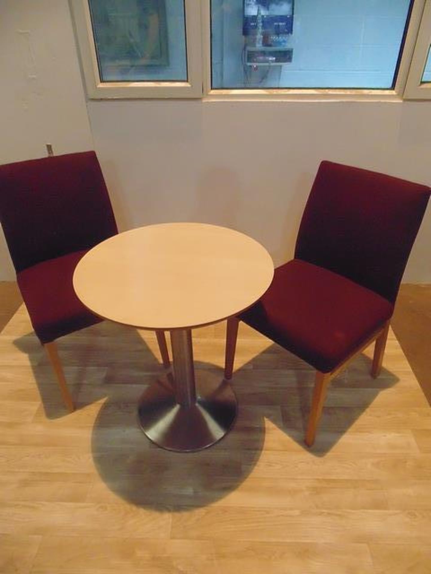 Beach round top table with stainless steel pedestal complete with two upholstered side chairs