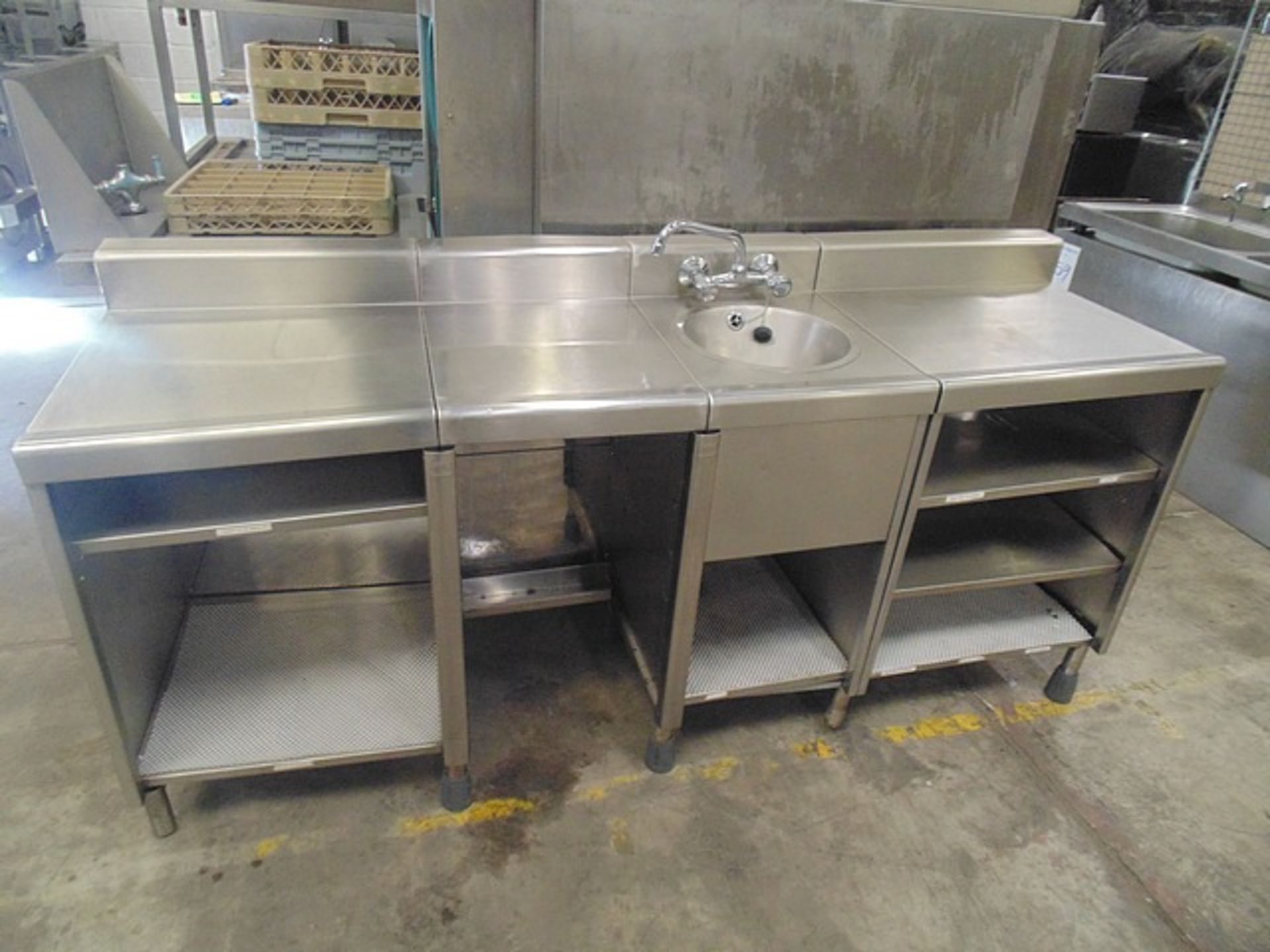 Stainless steel countering with integral hand wash basin and open cupboard shelving under 1930mm x