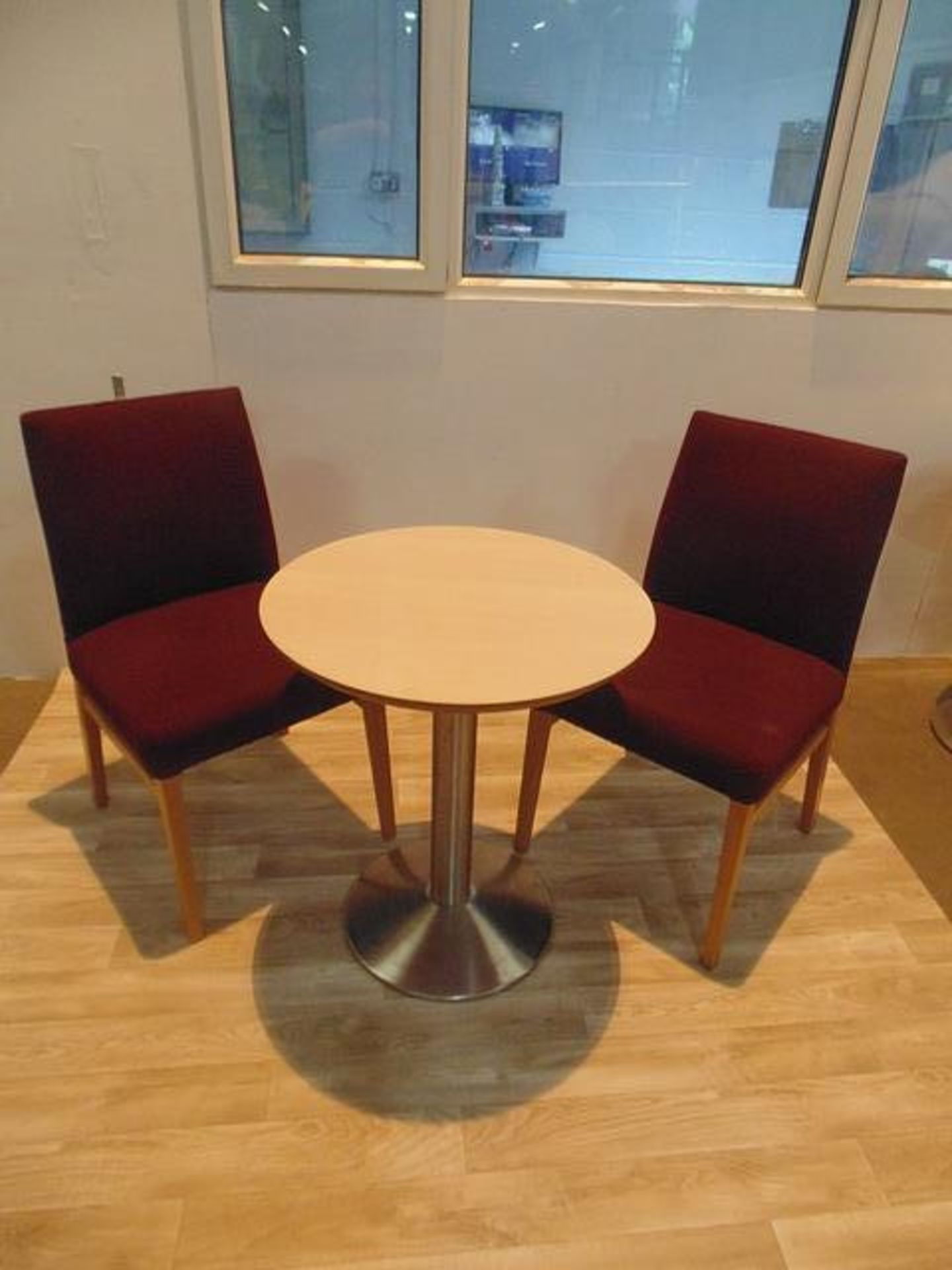 Beach round top table with stainless steel pedestal complete with two upholstered side chairs