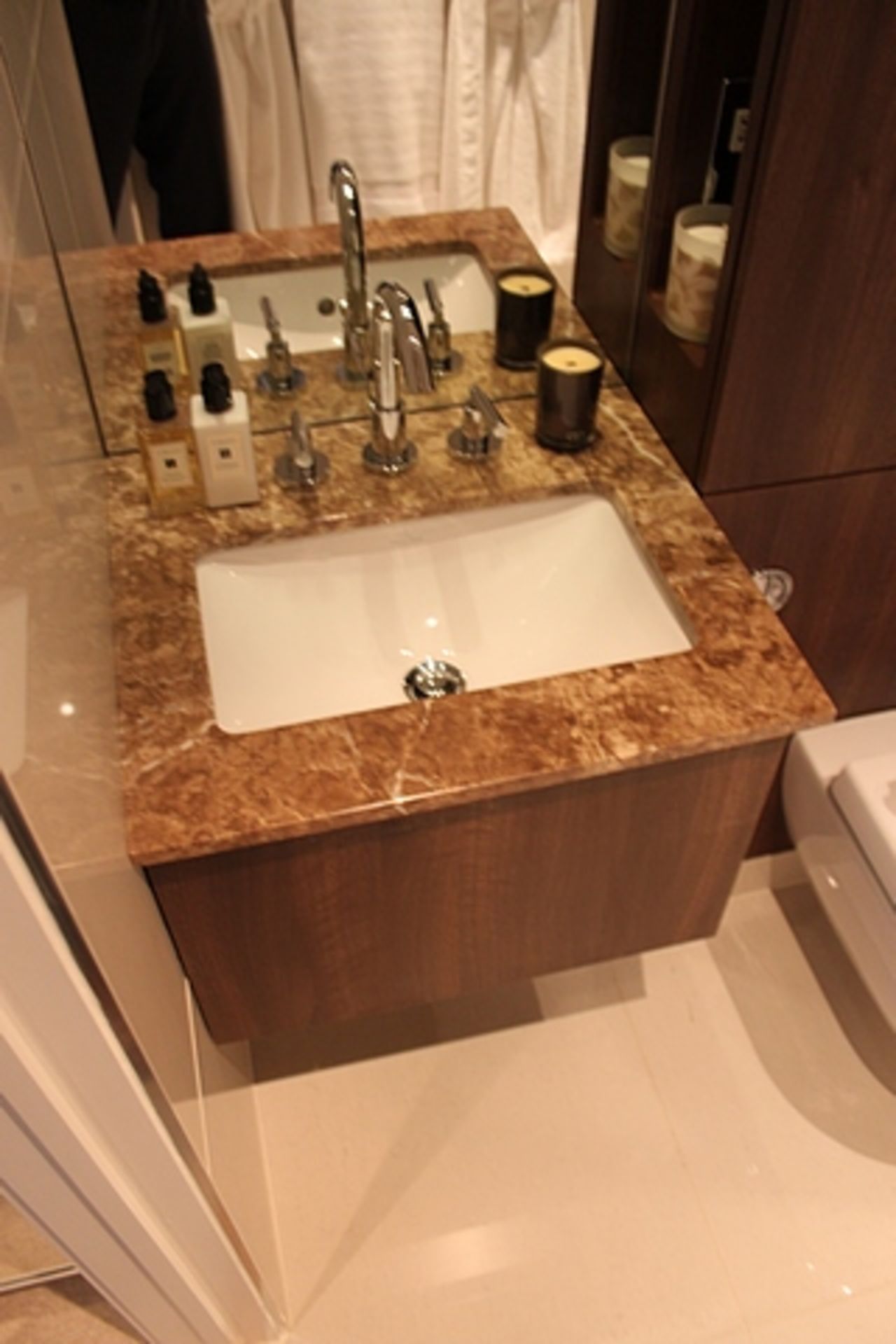 A Villeroy & Boch bathroom suite comprising of stone basin and vanity, WC pan, walk in shower and