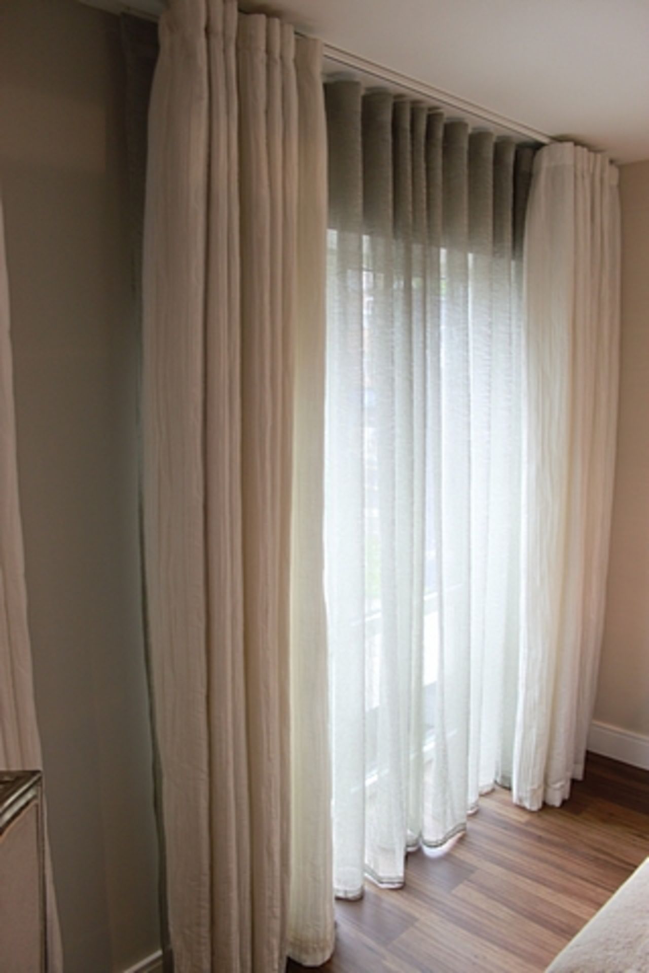 A pair of thermal cream lined drapes with voile panels 2700mm x 2500mm