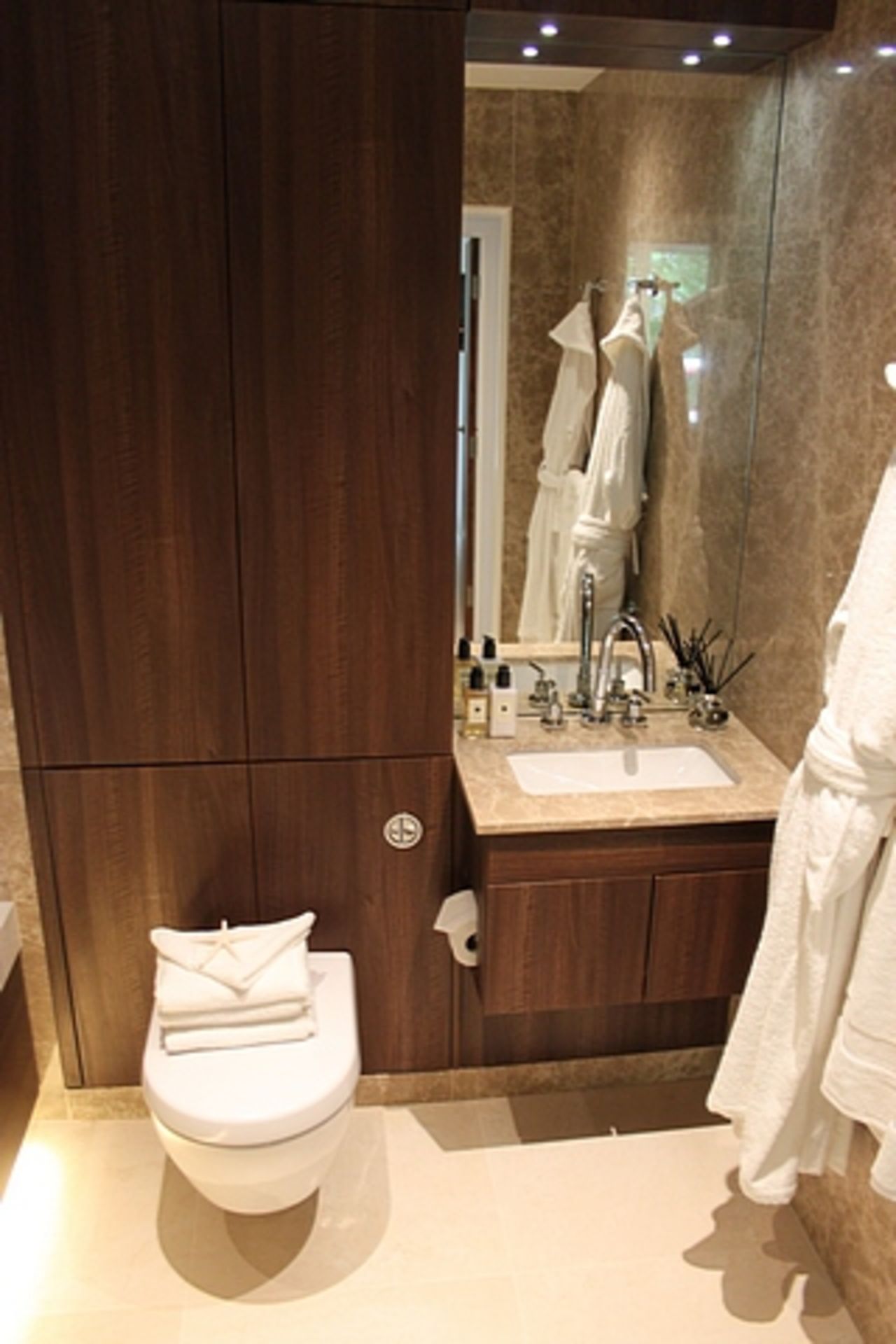 A Villeroy & Boch bathroom suite comprising of stone basin and vanity, WC pan, bath and fittings