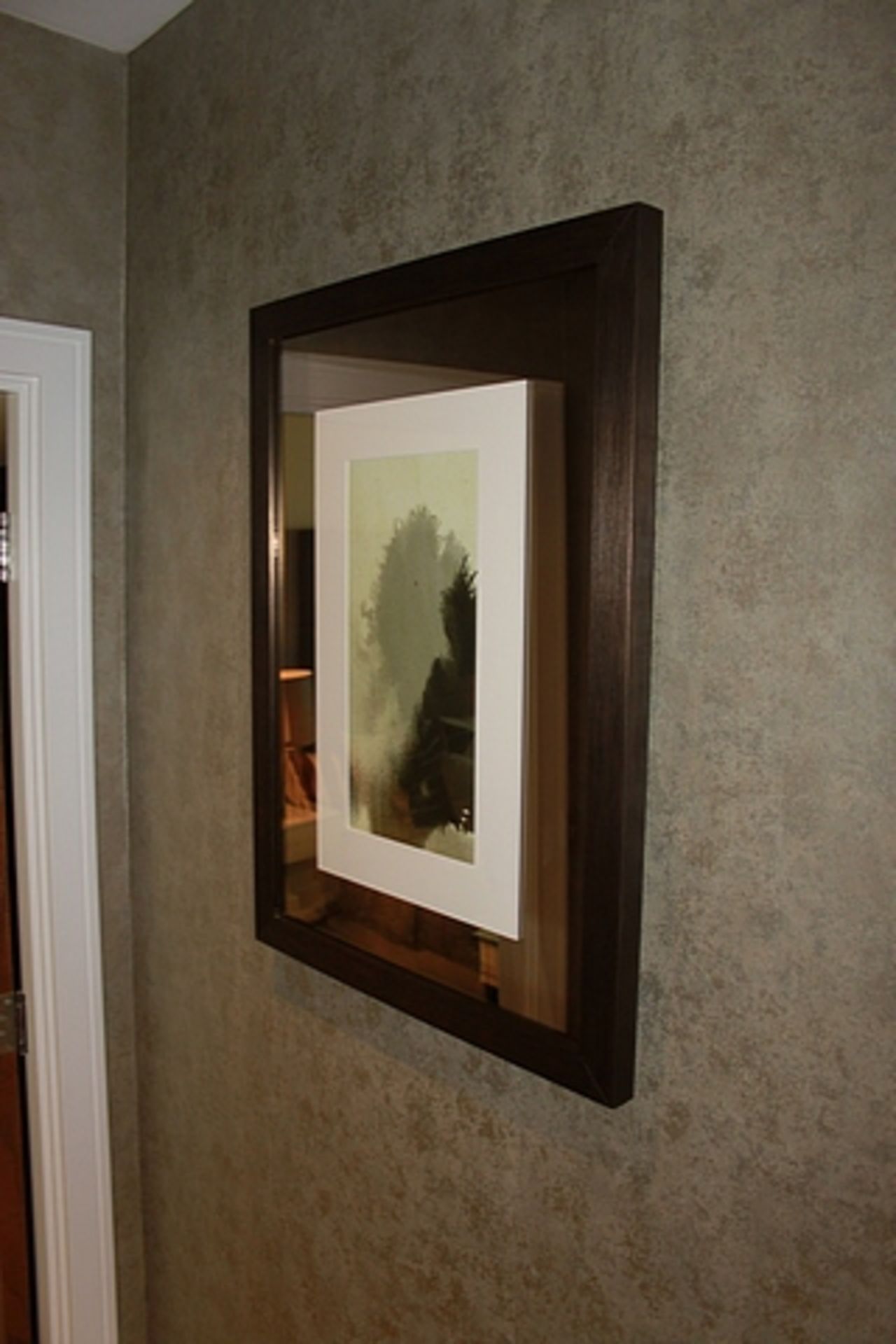 A pair of metal framed wall art 550mm x 550mm