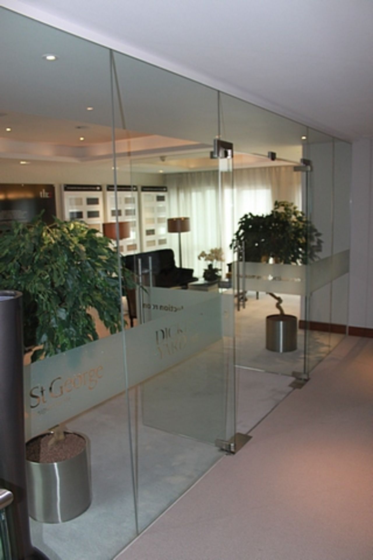 Glass partition with two hinged doors (doors 840mm x 2100mm each) overall approximately 6m x 2.5m