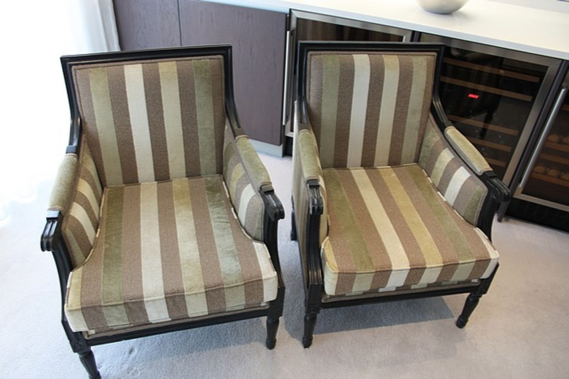 A pair of upholstered library chairs in striped green and neutral pattern material 570mm x 680mm x