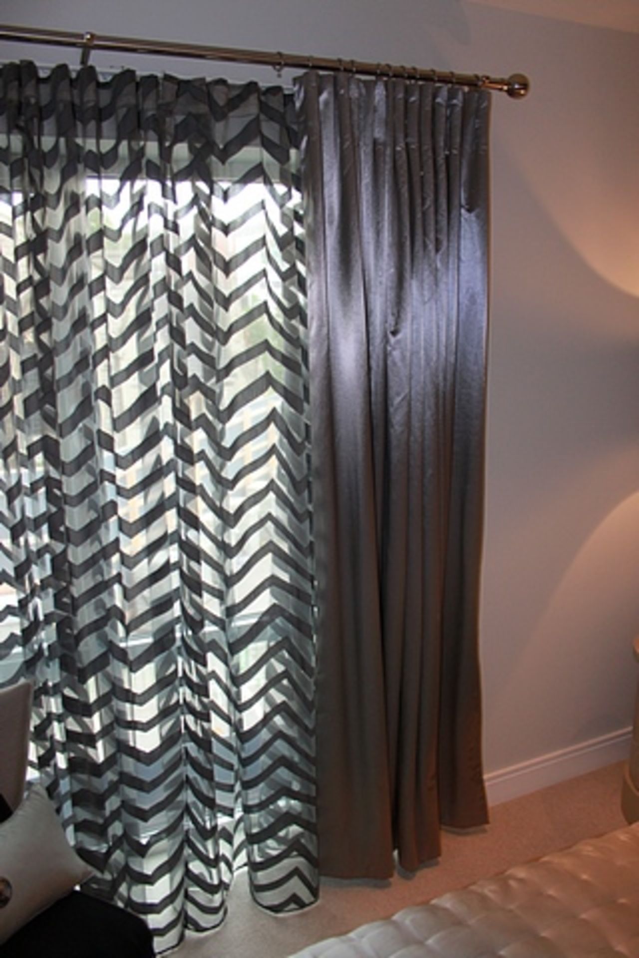 A pair of lined drapes with voile panel and silver rail 2000mm x 2300mm