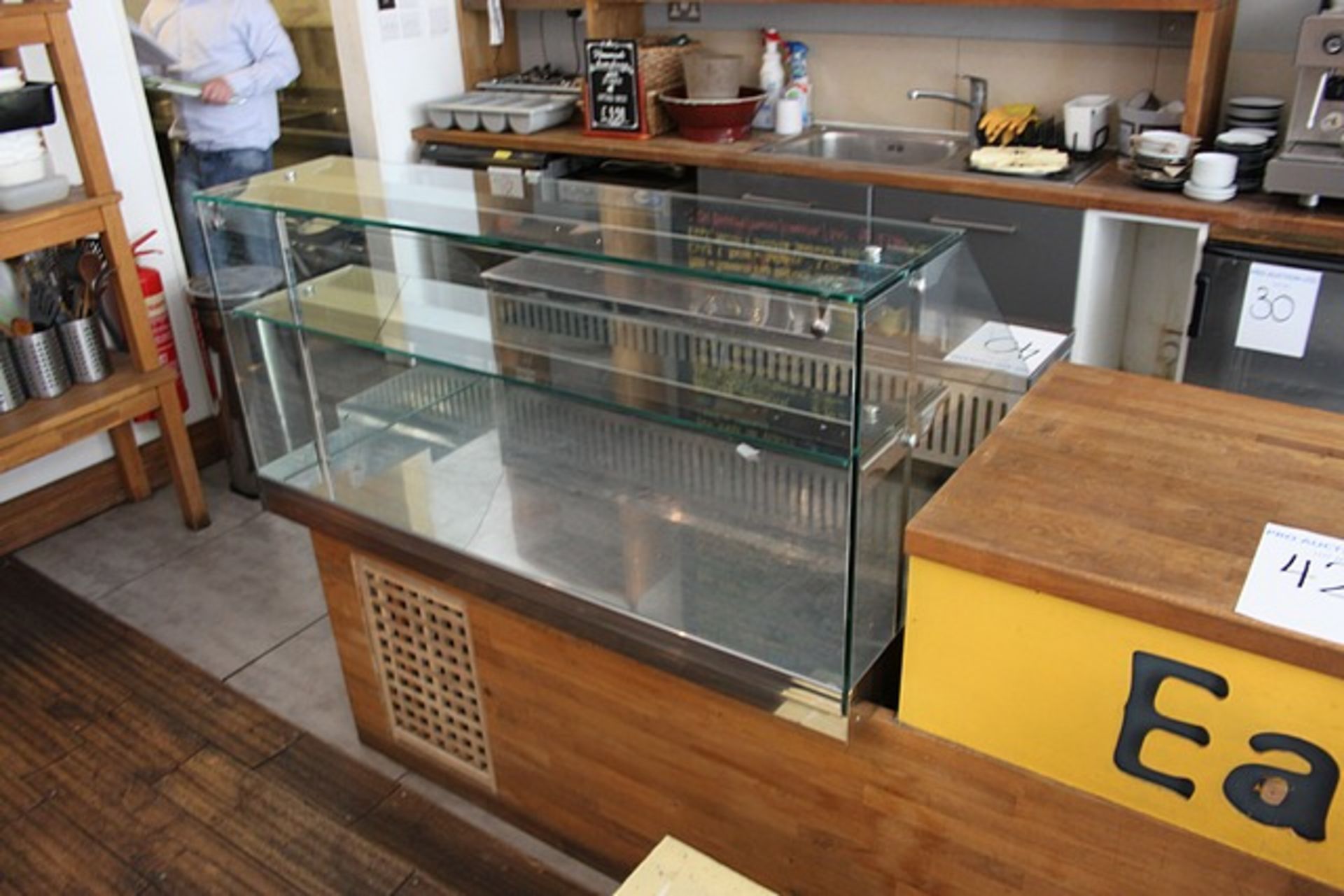 Refrigerated preparation counter serve over glass fronted counter with internal shelf and open