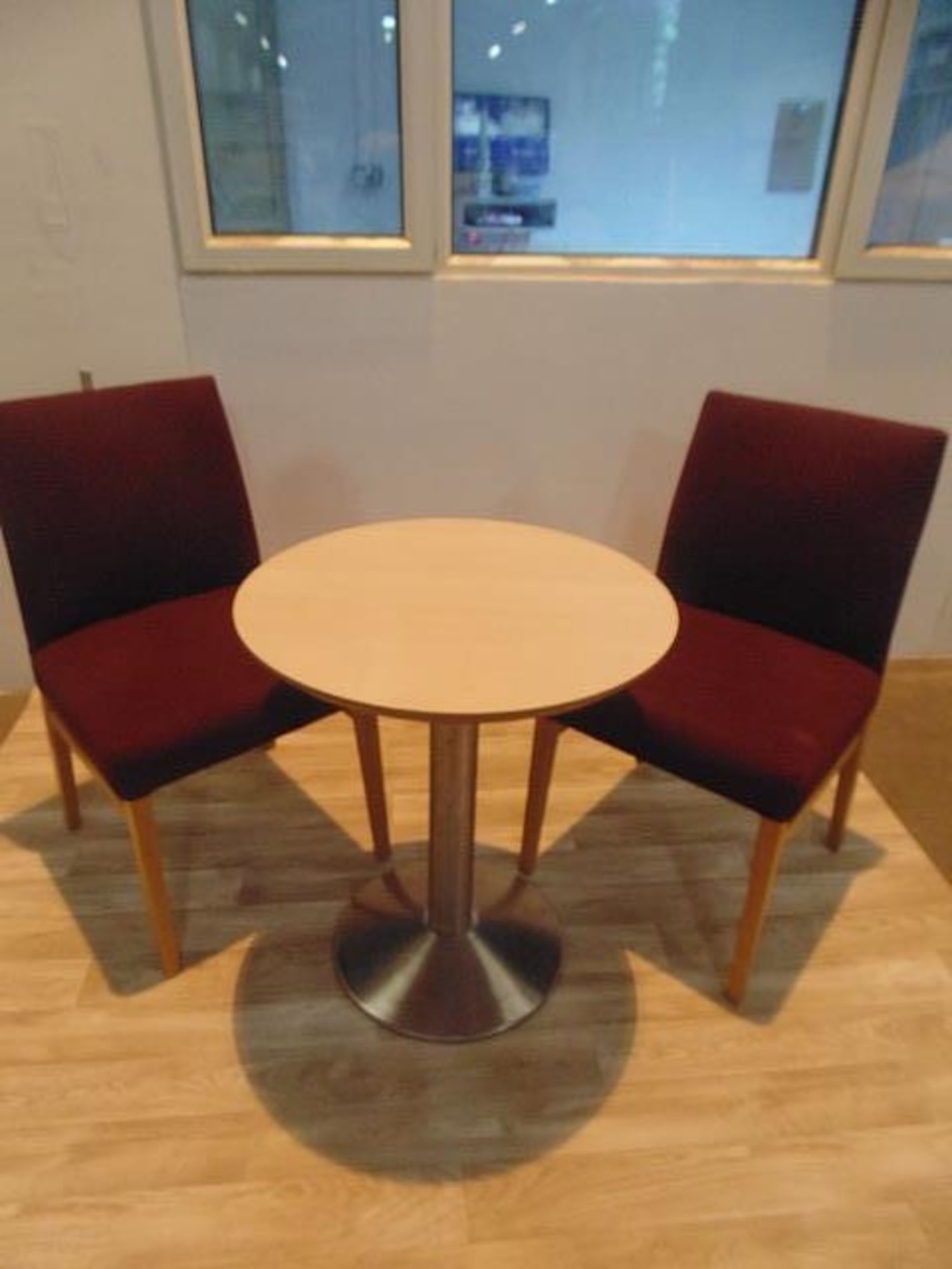 Beach round top table with stainless steel pedestal complete with two upholstered side chairs