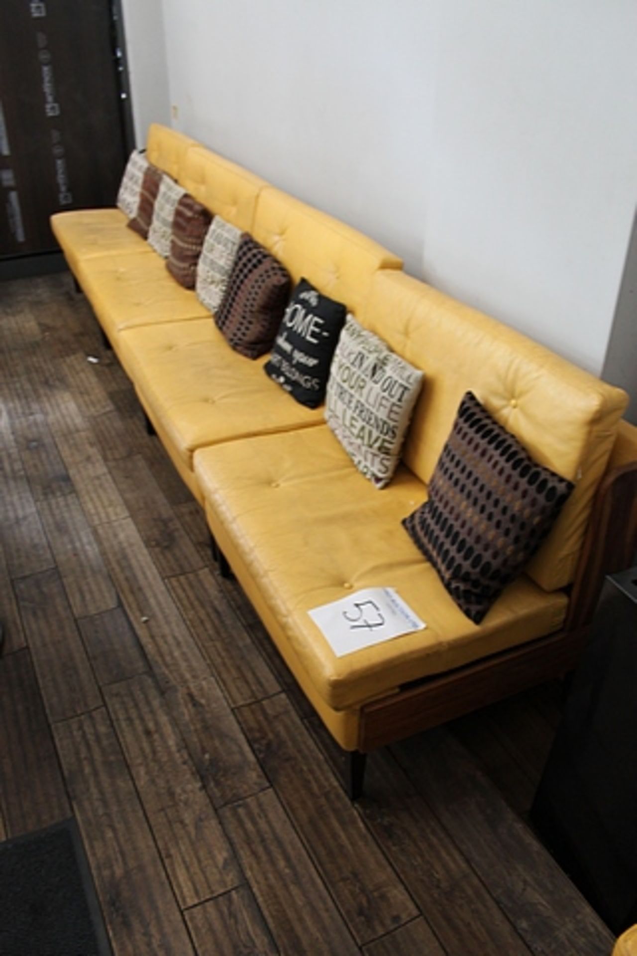 Bench sofa in faux yellow tufted leather 3950mm on hardwood dark stained frame 540mm seat pitch x