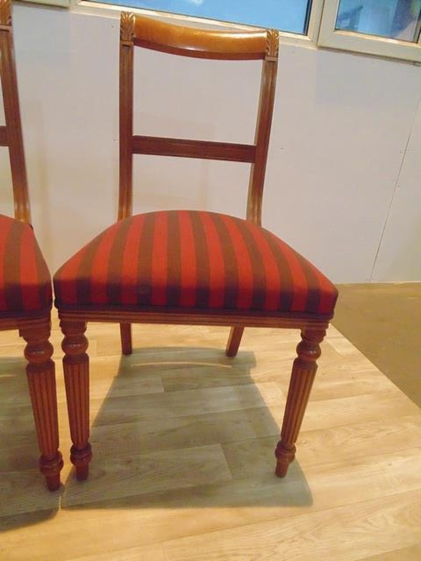 A set of four Regency style striped mahogany dining chairs, moulded top rails over a central - Image 2 of 2