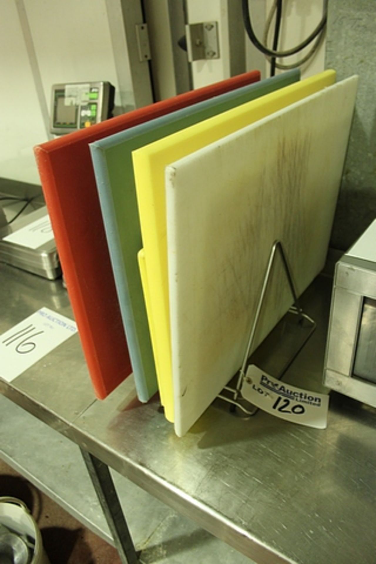 Various colour coded high density chopping boards and stand