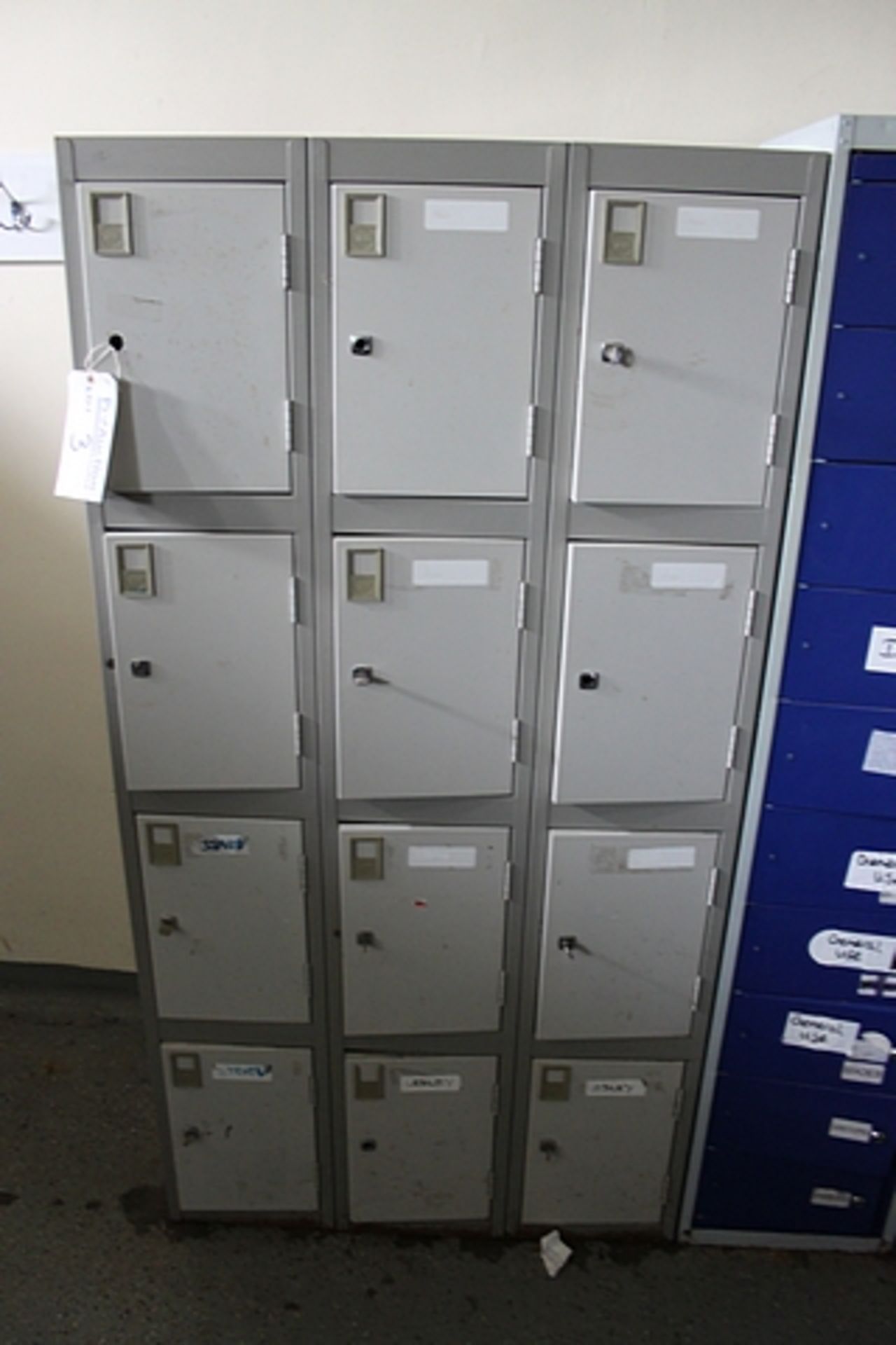 A bank of 12 x personnel lockers reinforced door & welded frame design hardwearing anti-bacterial