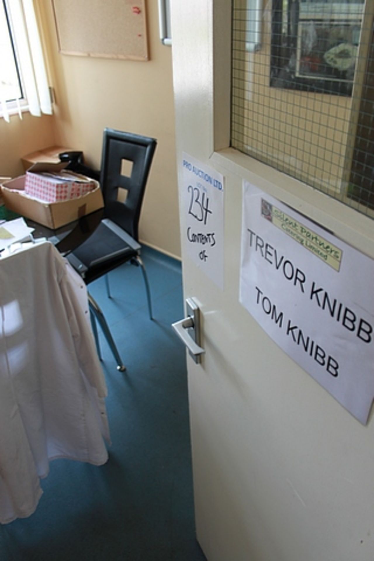 Content of managers office comprising desk, office chair, storage rack and two door storage cupboard