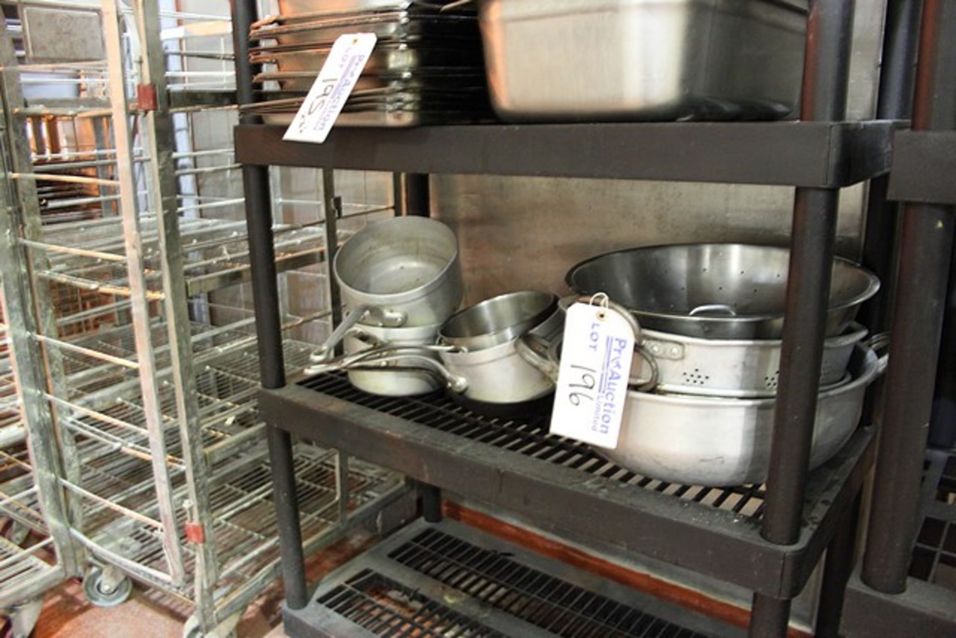 Various aluminium pans and collanders as found