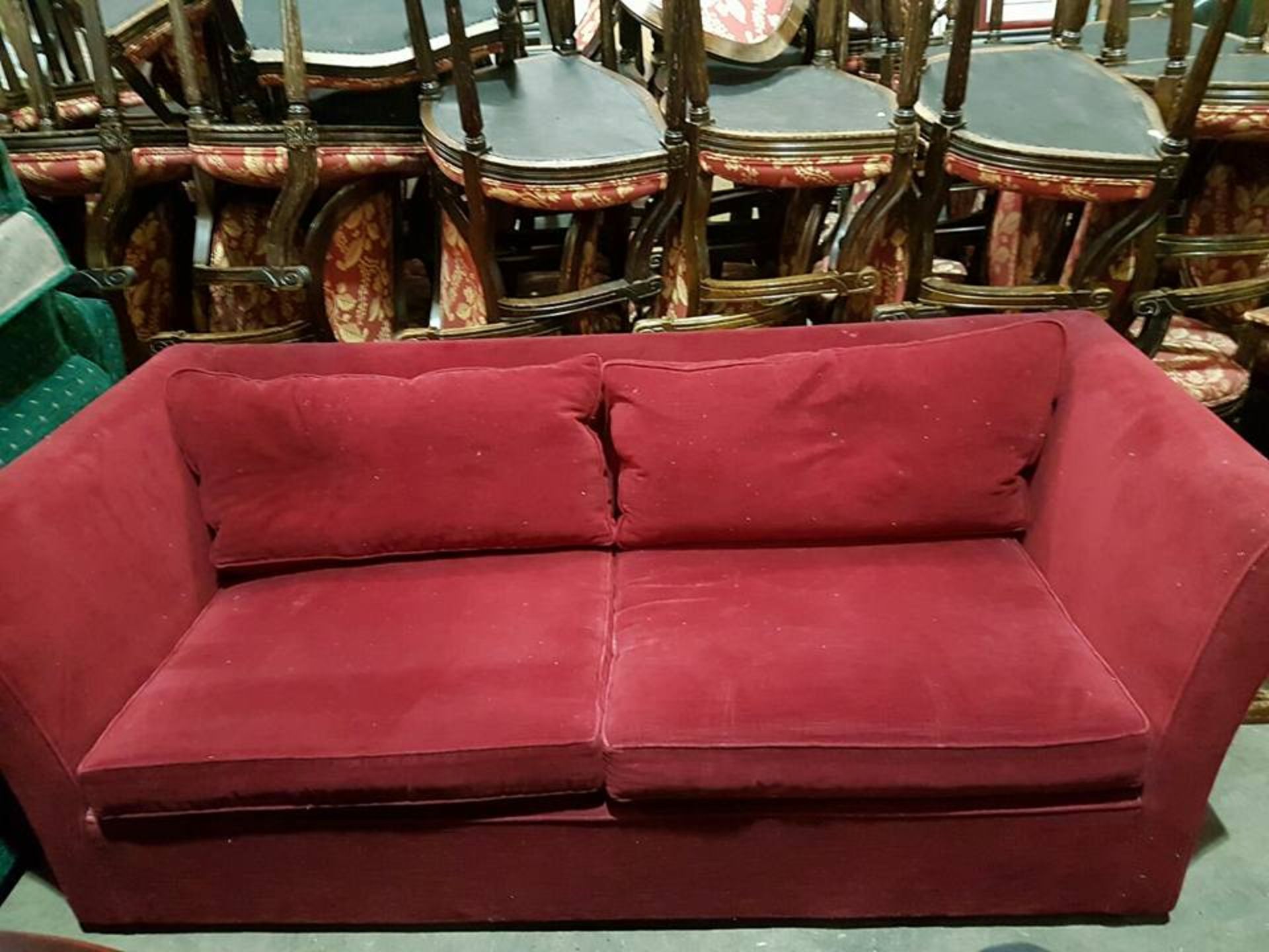 Two seater sofa red upholstered contract grade hardwood framed with high rolled arms seat cushion,