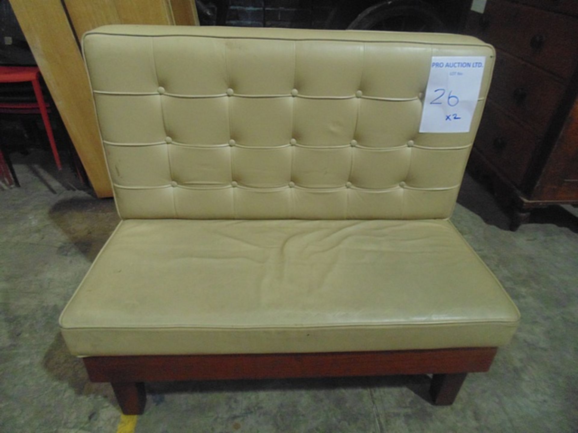 Cream faux leather two seater banquette 1130mm x 650mm x 980mm