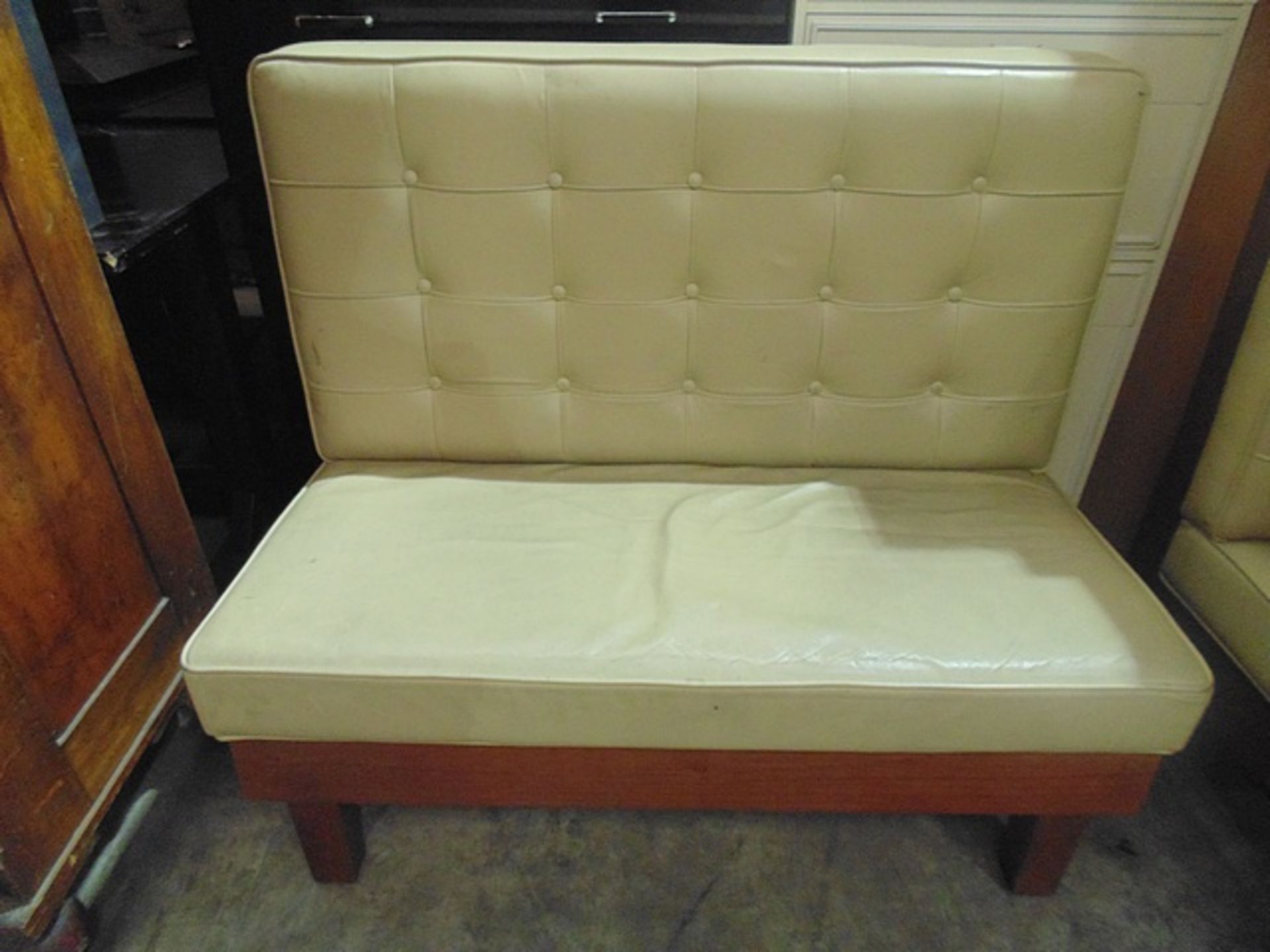 Cream faux leather two seater banquette 1130mm x 650mm x 980mm