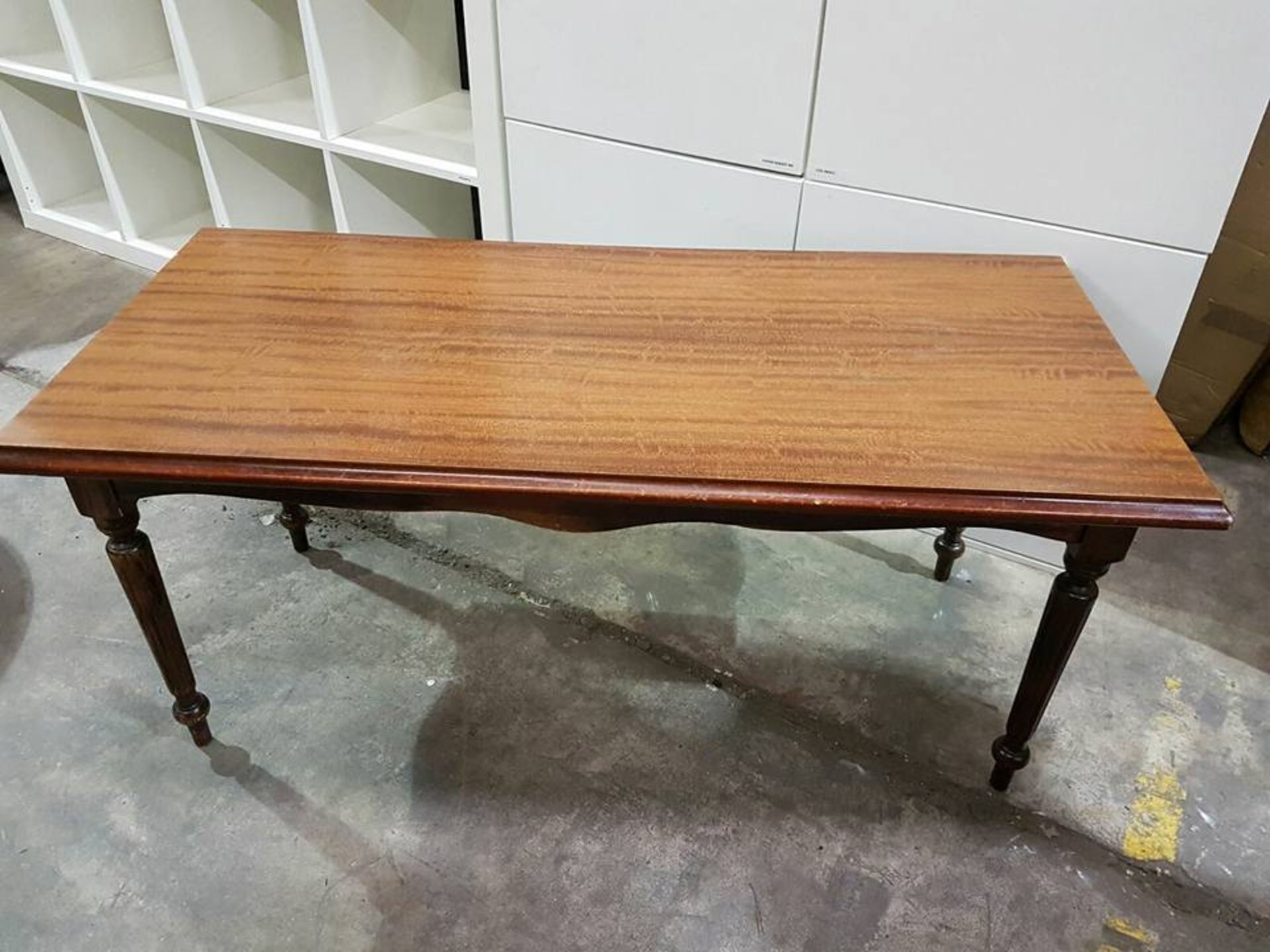 A Victorian reproduction mahogany coffee table with carved apron supported on four carved legs 430mm