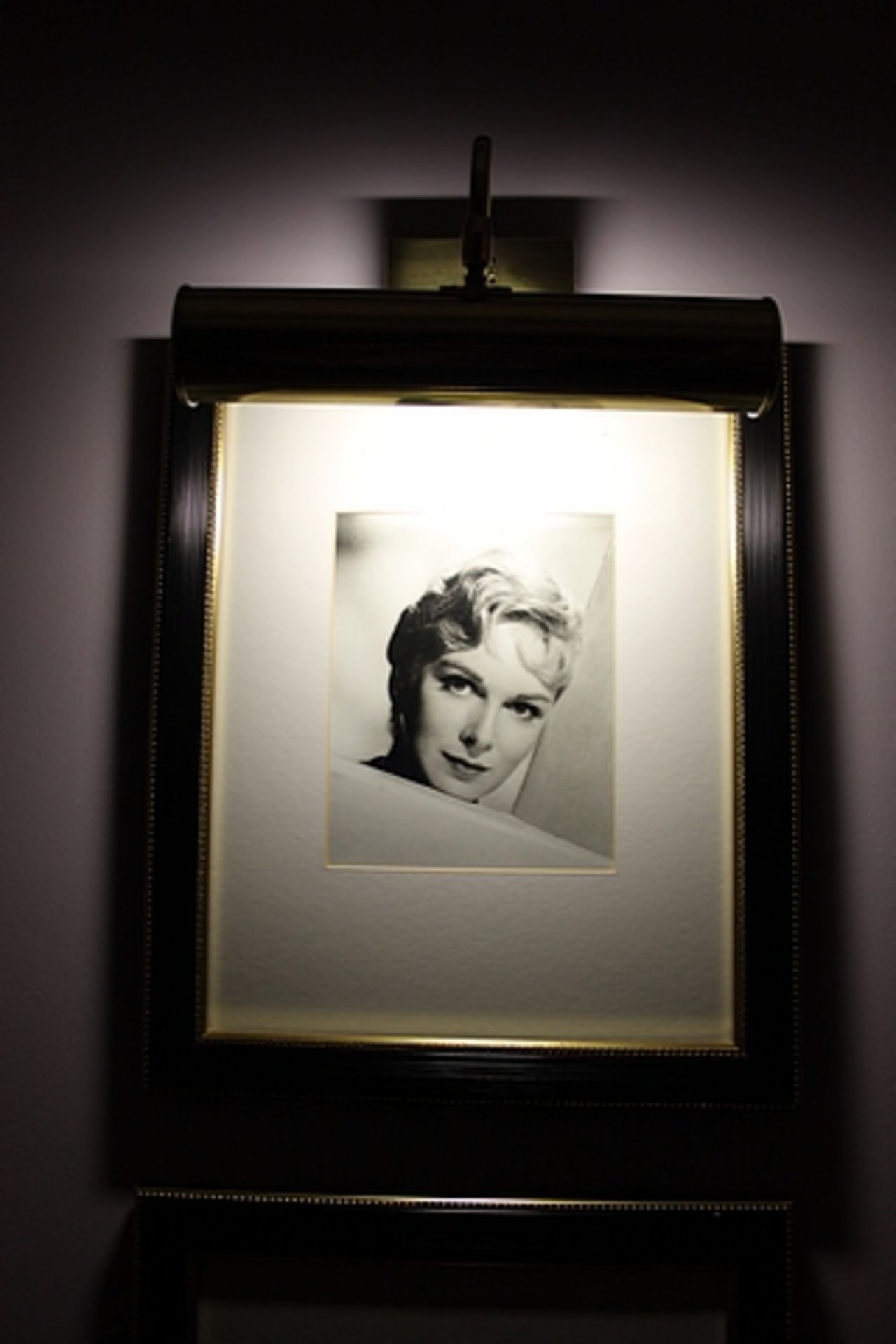 A pair of black and white photoprints, film stars framed 400mm x 480mm with brass picture lamp