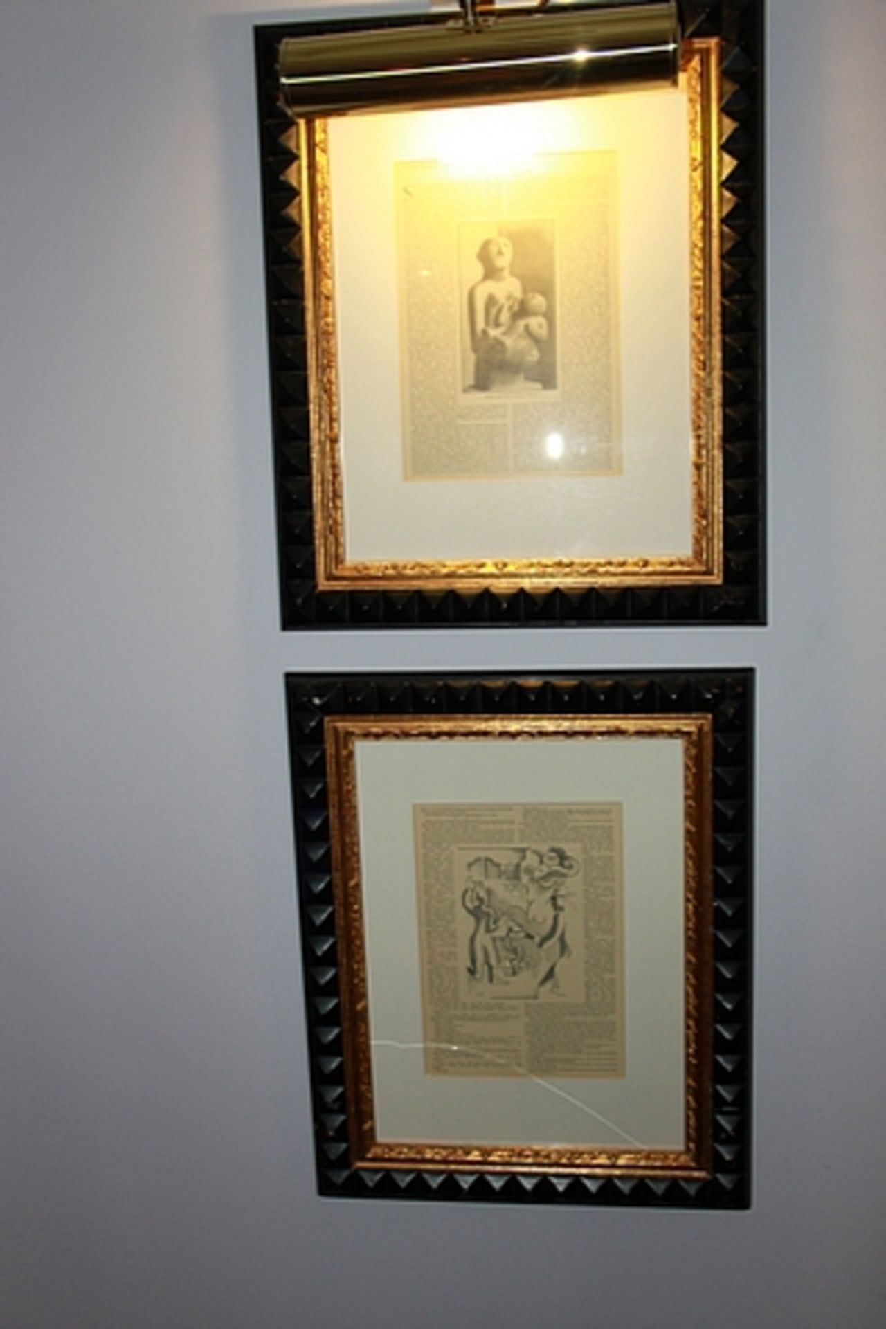 A pair of newspaper clipped posters , framed 440mm x 540mm with brass picture lamp