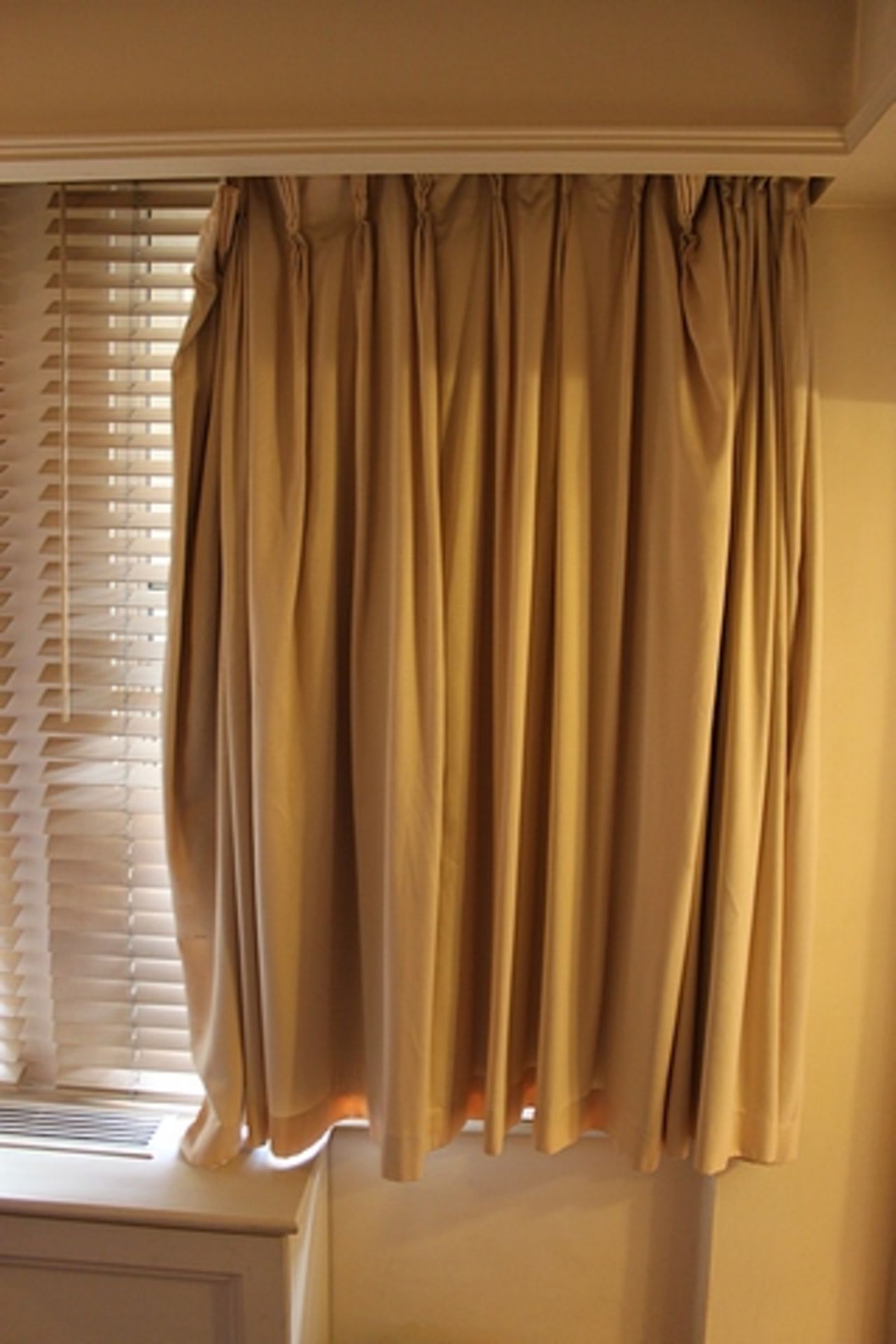 A pair of cream drape curtains spans 2400mm x 1600mm drop