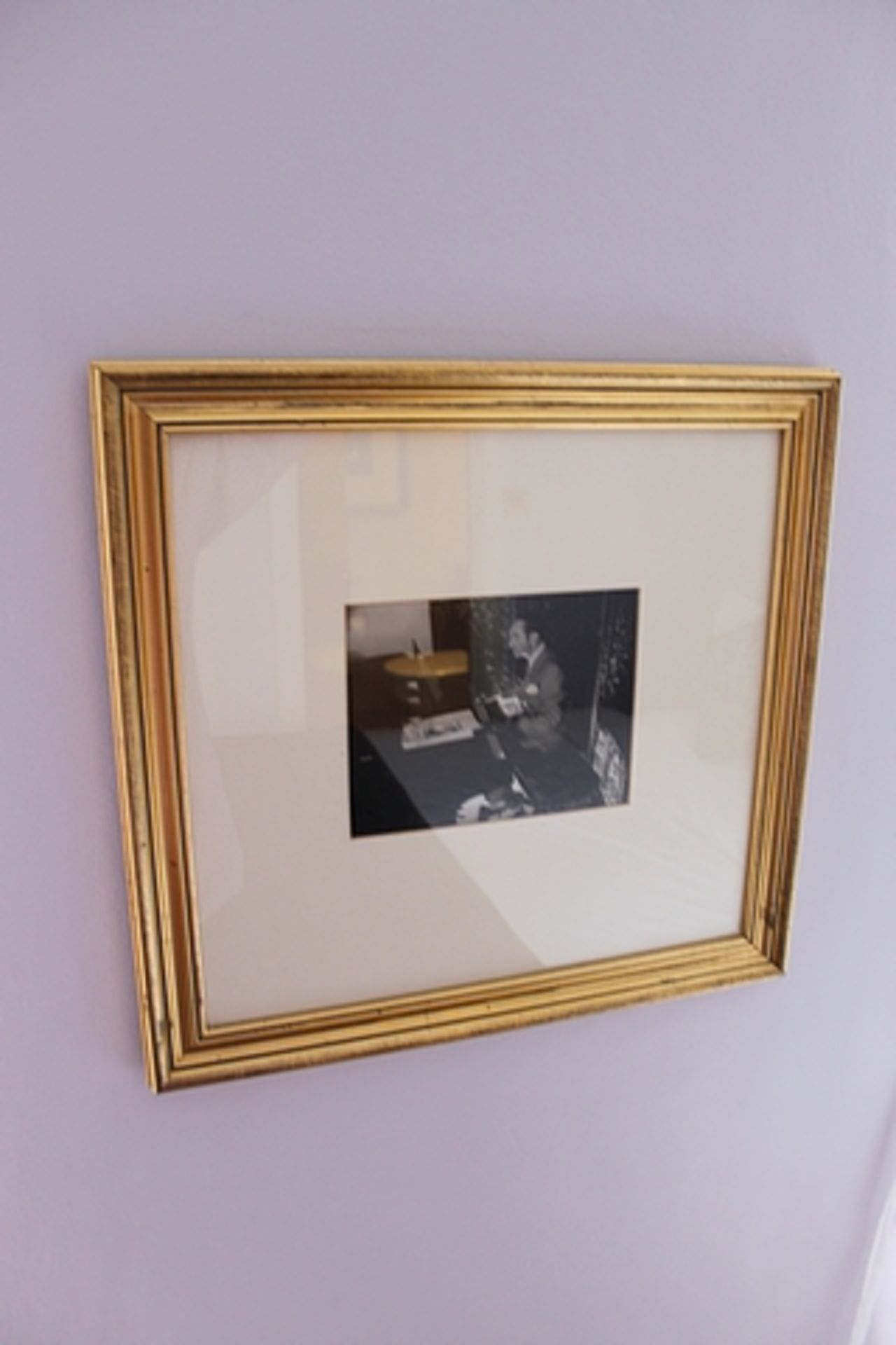 A framed photoprint depicting piano player 450mm x 430mm