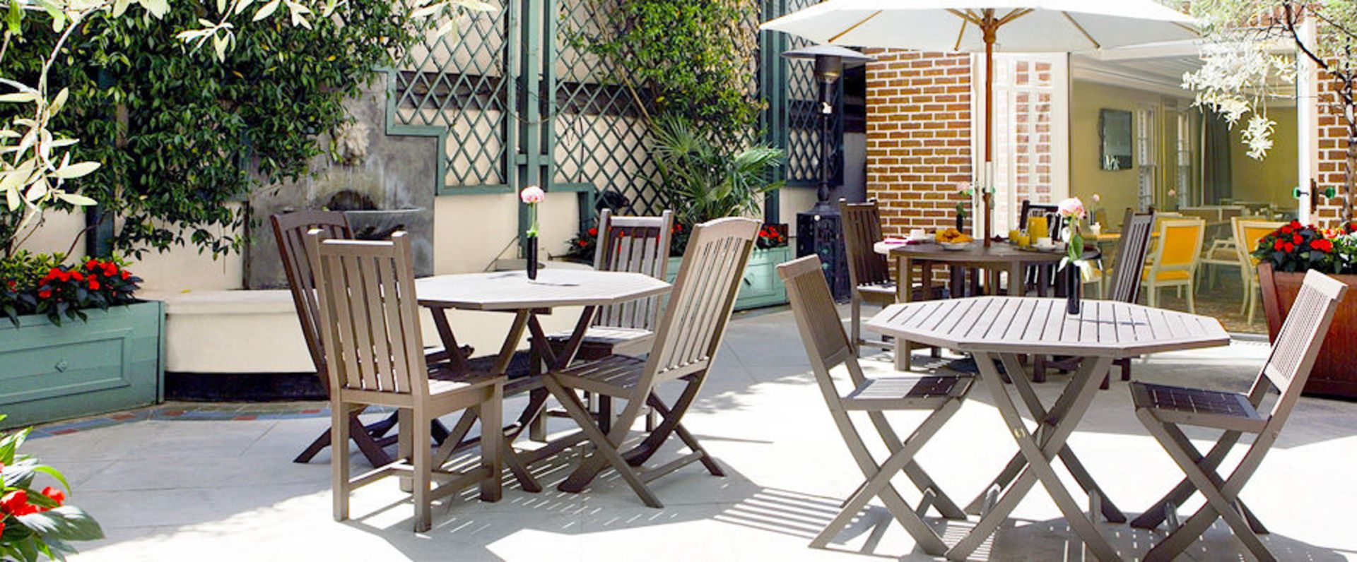 Classically styled 920mm round stained teak garden table complete with 2 chairs all stained