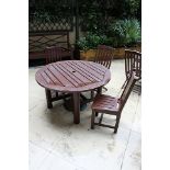 Classically styled 1300mm round stained teak garden table complete with 3 chairs all stained