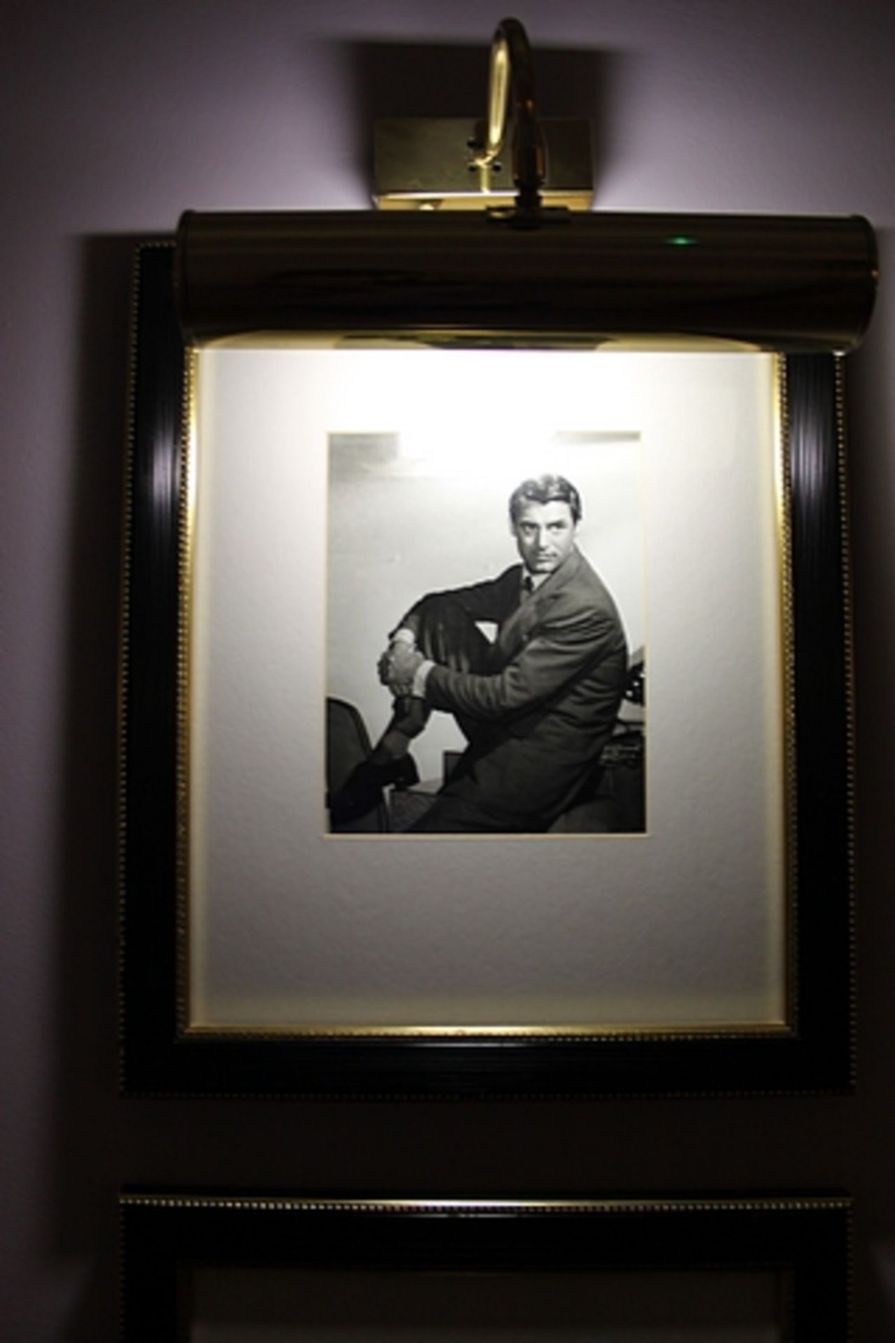 A pair of black and white photoprints, film stars framed 400mm x 480mm with brass picture lamp