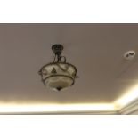 A set of 3 rustic ceiling down lighters the frosted glass dome shade mounted within a decorative